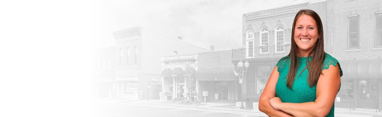 Image of Mortgage Loan Originator Andrea Sanson in front of a local downtown.