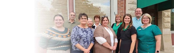 Discover Oxford board members and Alliance Bank staff in front of Oxford office.