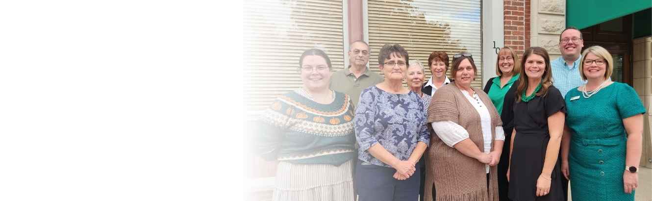 Discover Oxford board members and Alliance Bank staff in front of Oxford office.